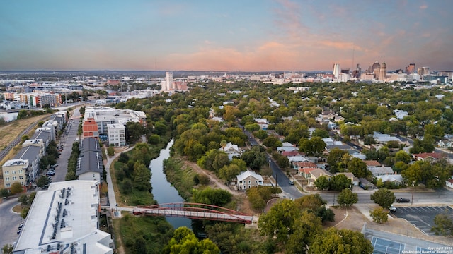 aerial view at dusk with a water view