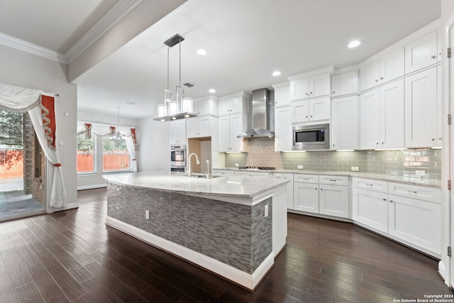 kitchen featuring wall chimney range hood, white cabinetry, and dark hardwood / wood-style flooring