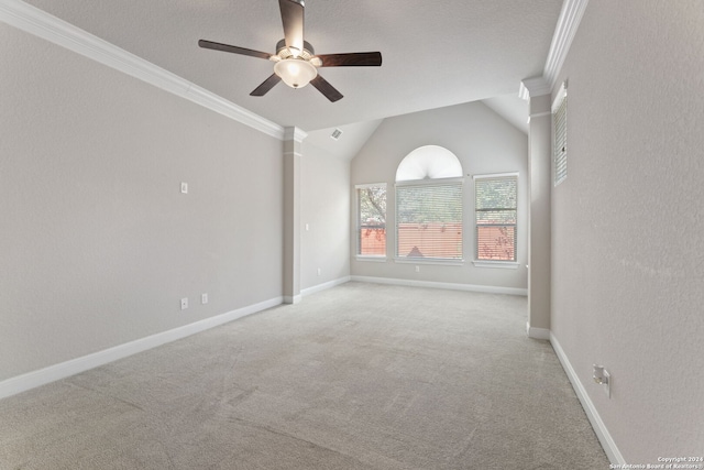 empty room with crown molding, light colored carpet, and ceiling fan