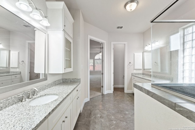 bathroom with vanity and ceiling fan