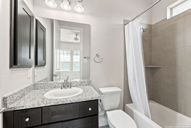 full bathroom featuring vanity, toilet, shower / tub combo, and ceiling fan