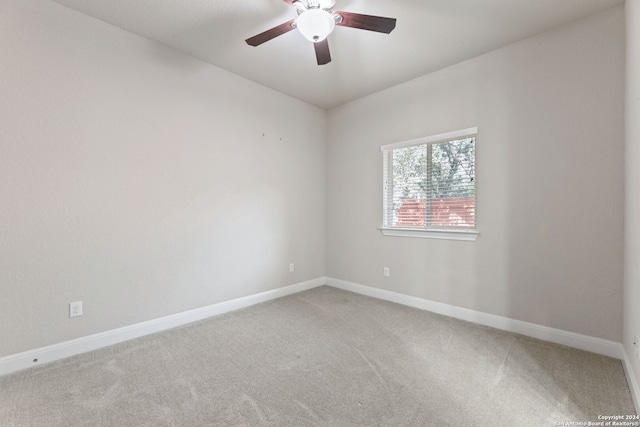 spare room with carpet flooring and ceiling fan