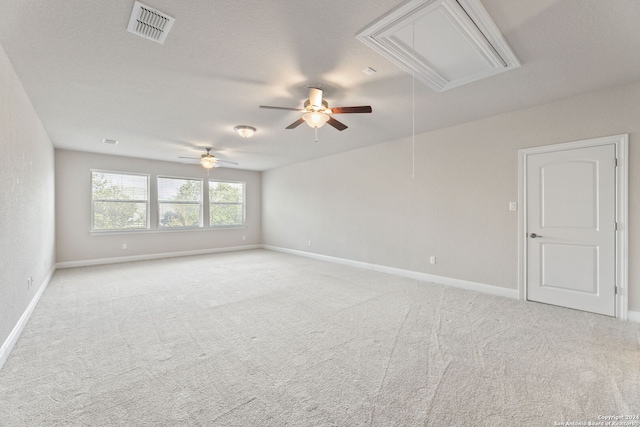 carpeted empty room with ceiling fan