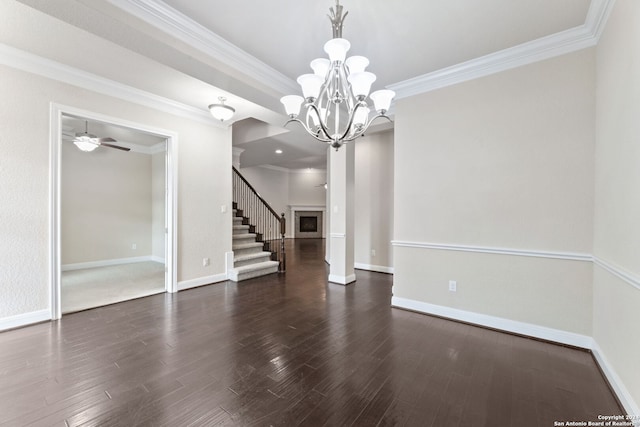 interior space with crown molding, dark hardwood / wood-style floors, and ceiling fan with notable chandelier