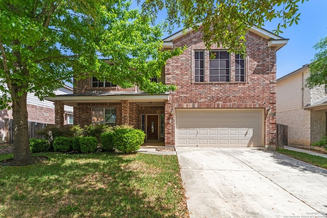 front of property with a front yard and a garage