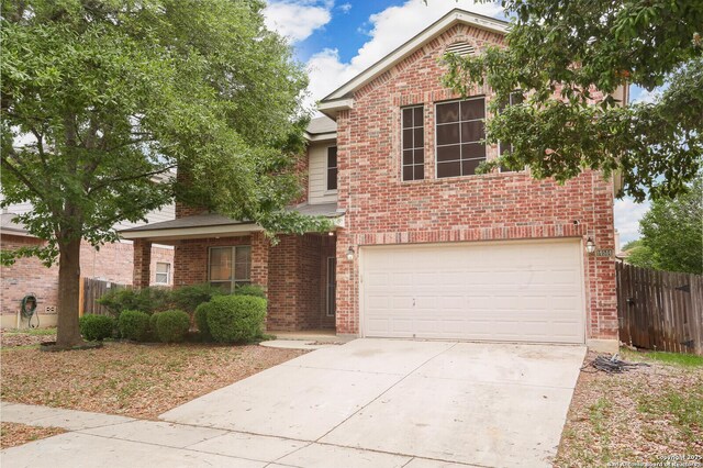 14514 Redwood Vly, Helotes, TX 78023 - view of front of home featuring a garage, brick siding, fence, and driveway