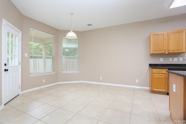 14514 Redwood Vly, Helotes, TX 78023 - kitchen with pendant lighting, light tile patterned flooring, and baseboards