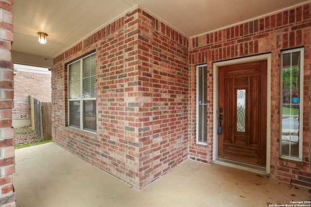 14514 Redwood Vly, Helotes, TX 78023 - doorway to property with brick siding and a porch