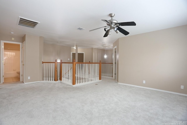14514 Redwood Vly, Helotes, TX 78023 - empty room with light colored carpet, a ceiling fan, and baseboards