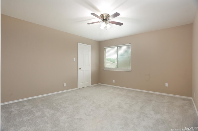 14514 Redwood Vly, Helotes, TX 78023 - unfurnished room featuring light colored carpet, ceiling fan, and baseboards