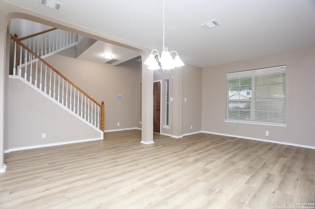 14514 Redwood Vly, Helotes, TX 78023 - unfurnished living room featuring wood finished floors, stairway, and baseboards