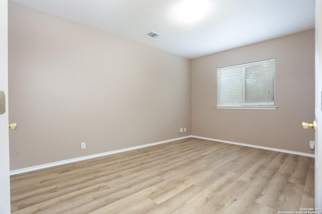 14514 Redwood Vly, Helotes, TX 78023 - unfurnished room featuring light wood finished floors and baseboards