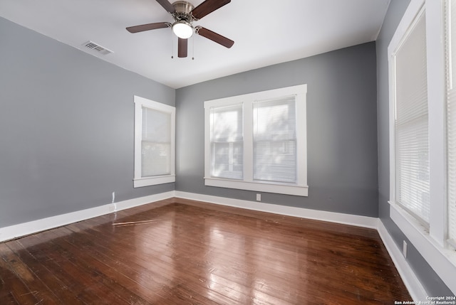 empty room featuring ceiling fan and hardwood / wood-style flooring