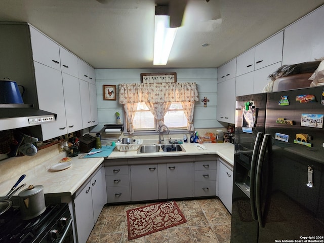 kitchen featuring white cabinets, black appliances, and sink