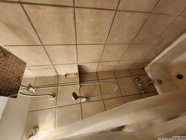 bathroom with shower / bathtub combination with curtain