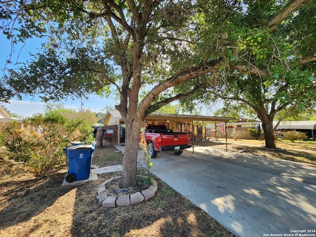 ranch-style home featuring a carport