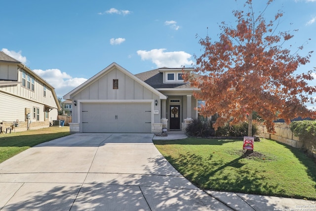 view of front of house featuring a front yard and a garage