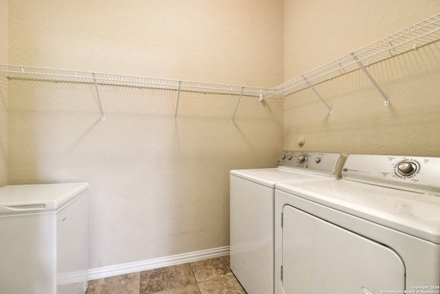 laundry room with separate washer and dryer