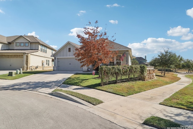 view of front of property featuring a front lawn and a garage