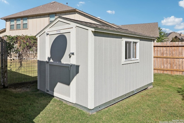 view of outdoor structure with a lawn