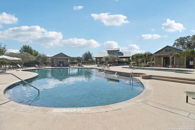 view of swimming pool featuring a patio