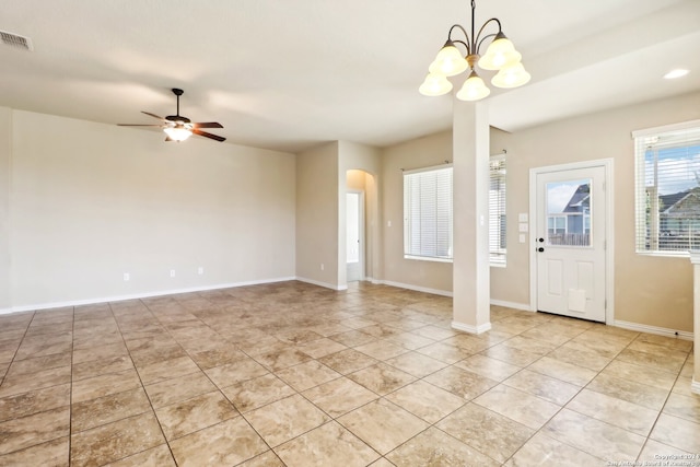 foyer with ceiling fan with notable chandelier and light tile patterned floors