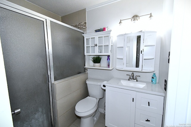 bathroom featuring a textured ceiling, walk in shower, tile walls, toilet, and vanity