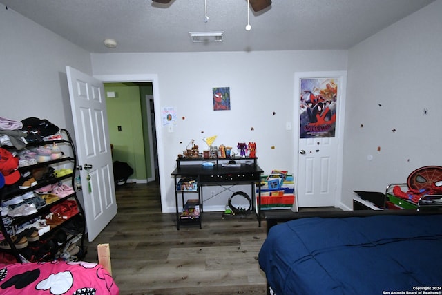 bedroom featuring hardwood / wood-style flooring and ceiling fan