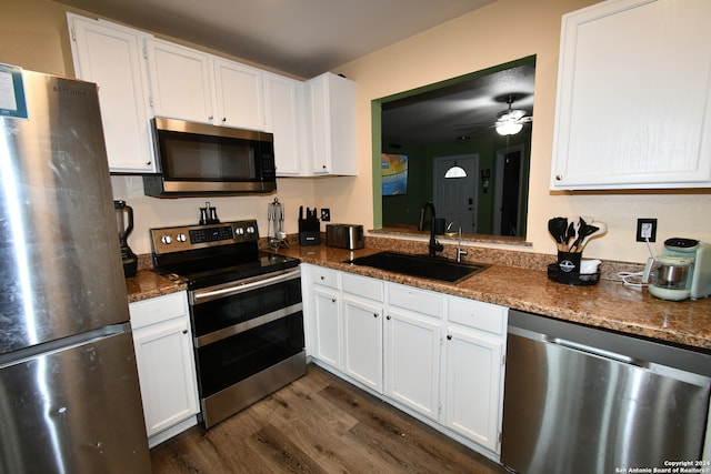 kitchen featuring stainless steel appliances, sink, dark hardwood / wood-style floors, and white cabinets