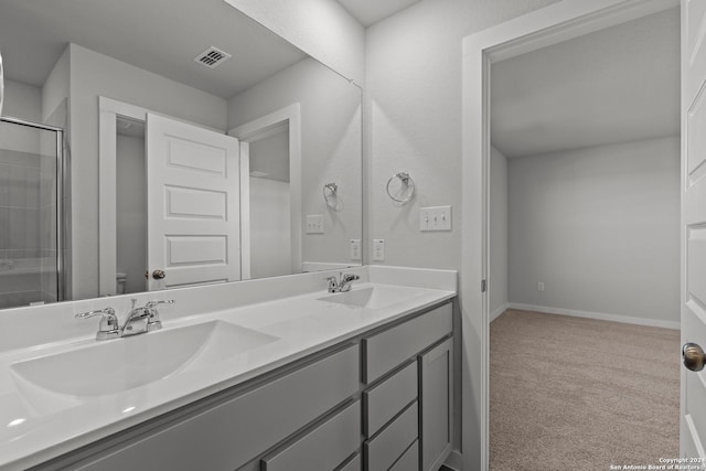 10719 Gilmore Gdn, San Antonio, TX 78109 - full bathroom with a sink, toilet, visible vents, and a shower stall