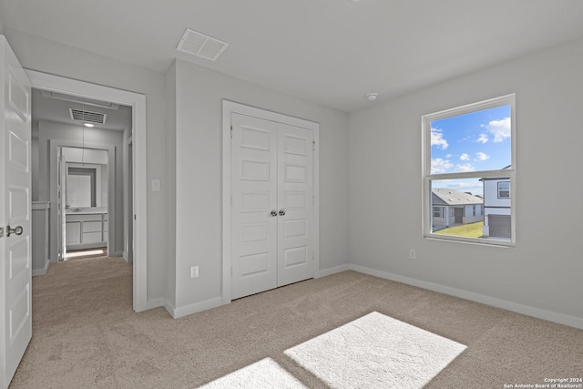 10719 Gilmore Gdn, San Antonio, TX 78109 - unfurnished bedroom with visible vents, carpet flooring, and a closet