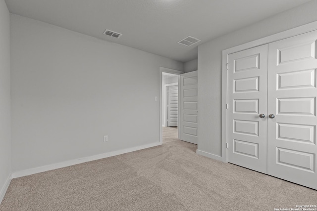 10719 Gilmore Gdn, San Antonio, TX 78109 - unfurnished bedroom featuring baseboards, visible vents, and carpet
