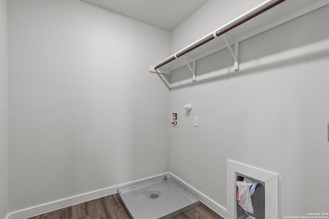10719 Gilmore Gdn, San Antonio, TX 78109 - clothes washing area featuring gas dryer hookup, dark wood-style flooring, washer hookup, and laundry area