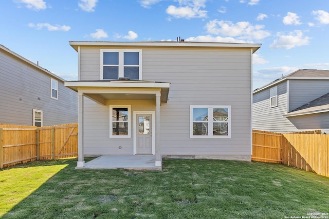 10719 Gilmore Gdn, San Antonio, TX 78109 - rear view of house featuring a patio, a fenced backyard, and a lawn