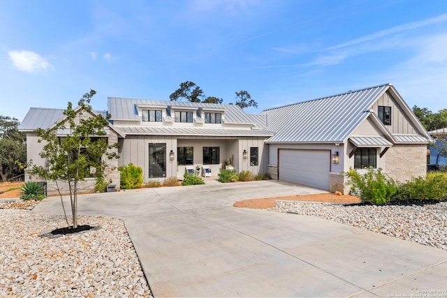 modern inspired farmhouse featuring a garage