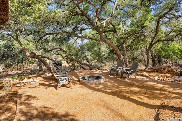 view of patio / terrace with a fire pit