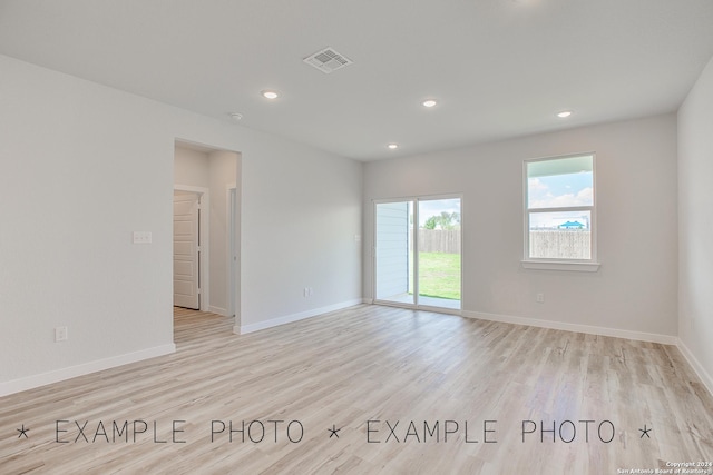 spare room with light hardwood / wood-style floors