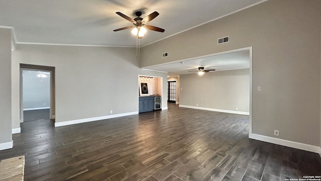 unfurnished living room with ornamental molding, ceiling fan, and dark hardwood / wood-style flooring