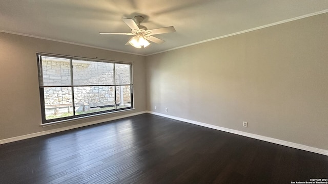 spare room featuring ornamental molding, dark wood-type flooring, and ceiling fan