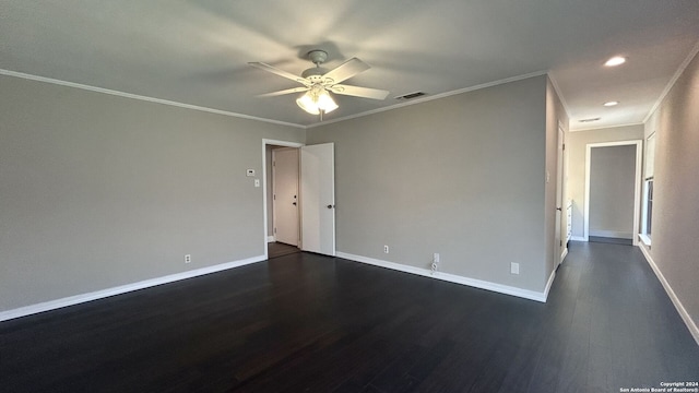 empty room with ceiling fan, ornamental molding, and dark hardwood / wood-style floors