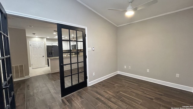 unfurnished room featuring french doors, ceiling fan, lofted ceiling, dark wood-type flooring, and ornamental molding