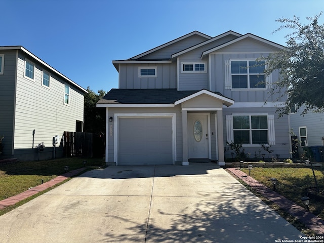 view of front of home featuring a garage and a front lawn