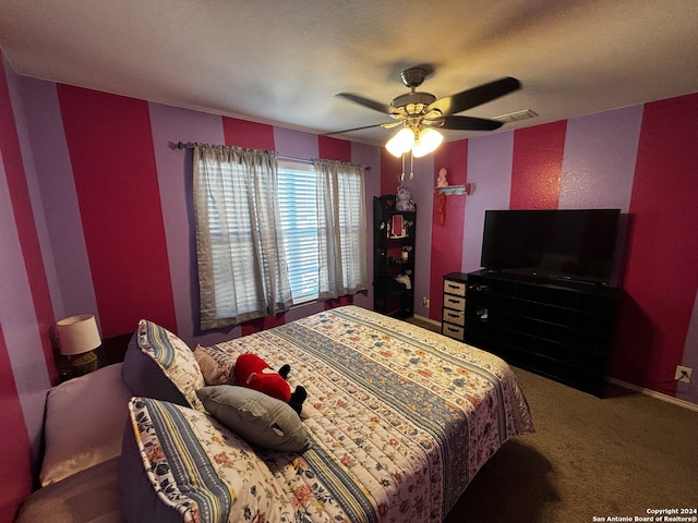 carpeted bedroom featuring ceiling fan