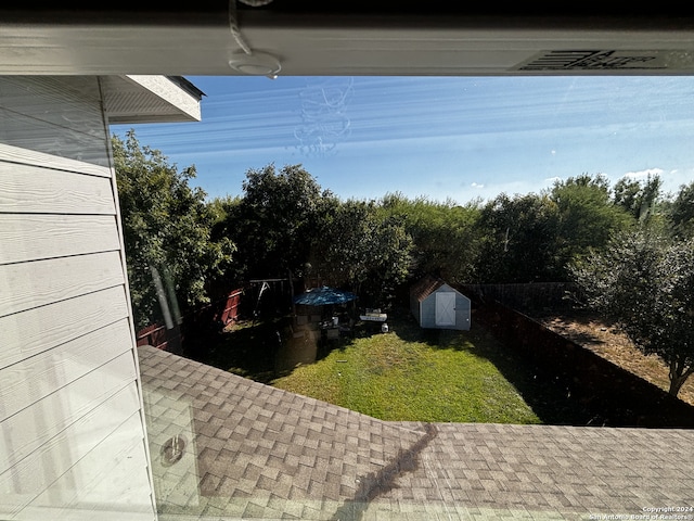 view of yard with a patio and a shed