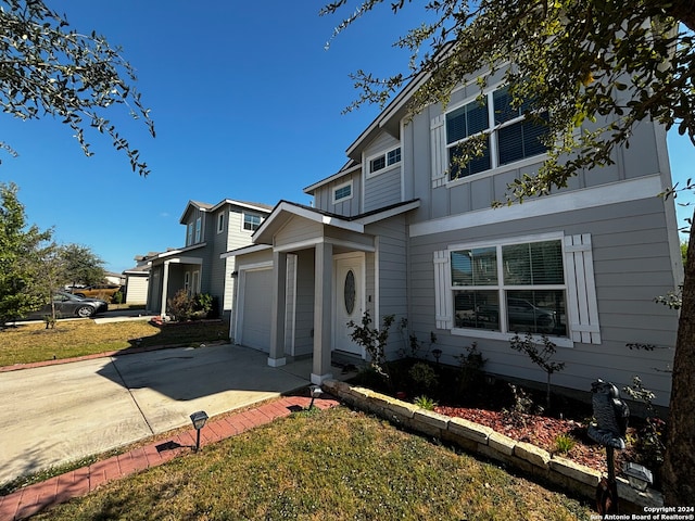 view of front facade with a front yard and a garage