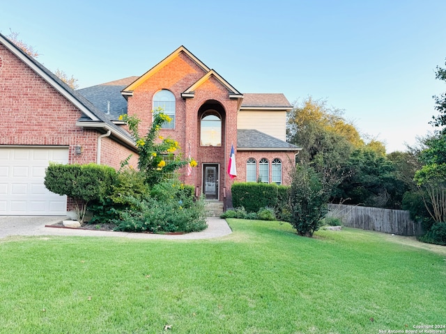 front of property with a garage and a front yard