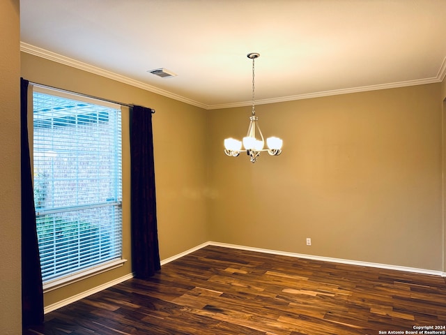 empty room with dark hardwood / wood-style floors, crown molding, and a notable chandelier