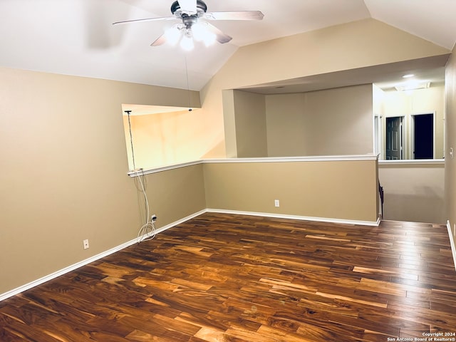 spare room with lofted ceiling, dark hardwood / wood-style floors, and ceiling fan