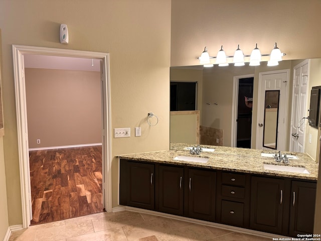 bathroom with hardwood / wood-style flooring and vanity