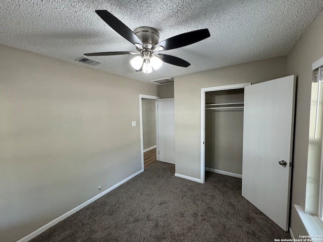 unfurnished bedroom with a textured ceiling, a closet, and ceiling fan